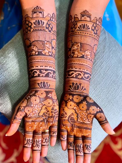 Another example of the Extravaganza package, with bold elephant motifs and intricate floral and geometric fillers for a grand bridal statement.