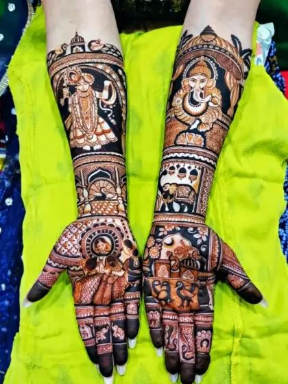 This vibrant design features portraits of Lord Krishna and Ganesha on the arms, with a bride and groom on the palms for a mix of divine and personal love.