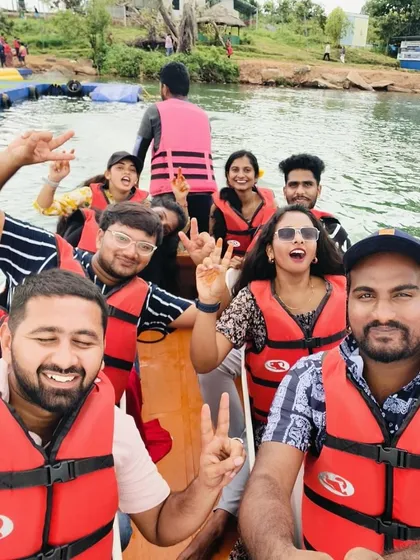 A selfie capturing the excitement of a boat ride in Coorg. Everyone is all smiles and ready for fun.