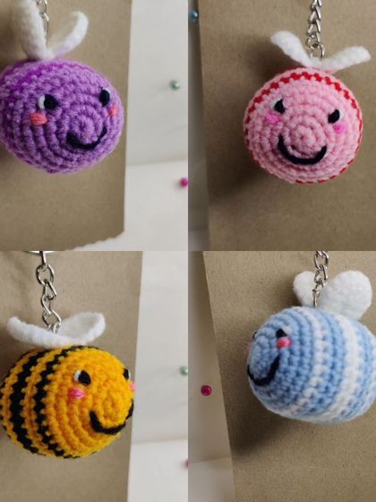 My super popular bumblebee keychains. They come in the classic yellow and black, but I also make them in fun colors like pink, blue, and purple.