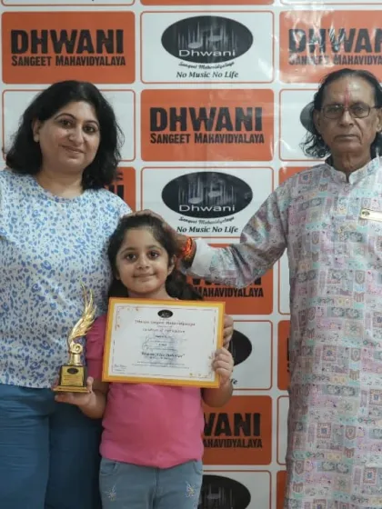 Three generations of support: a student with her mother and our senior guru.