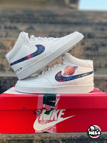 The complete set of cosmic-themed Nike high-tops, ready to be shipped.