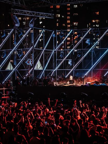 The stage design for Boris Brejcha featured sharp, geometric lighting that matched his precise musical style.