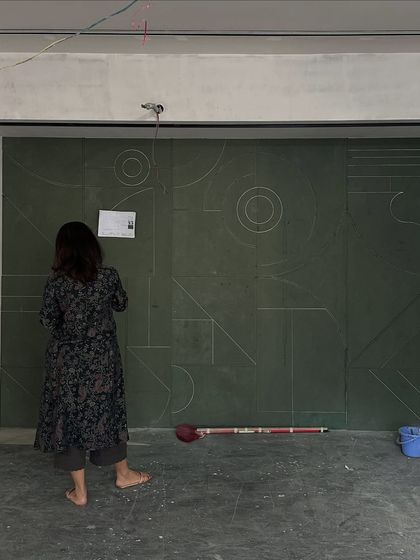 The very beginning of our custom Art Deco wall panel. Here, Sonal is on-site, marking out the geometric layout directly on the wall. This hands-on approach ensures every line and curve is perfectly placed before fabrication begins.