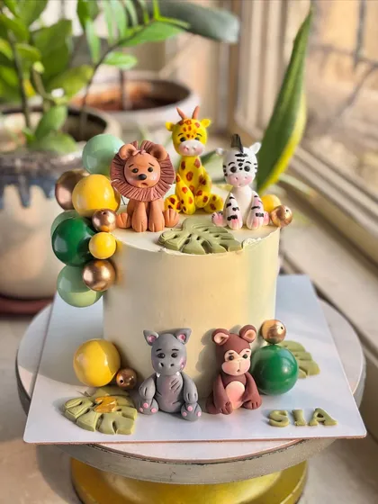 Where the jungle comes to life! This roarsome cake is loaded with adorable, hand-crafted fondant animal figurines like a lion, giraffe, and zebra, perfect for a little one’s big day.