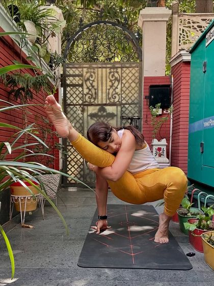 A variation of Visvamitrasana, this advanced arm balance and hip opener teaches us to find stillness in discomfort. It's about embracing challenges with grace, breath, and calm.