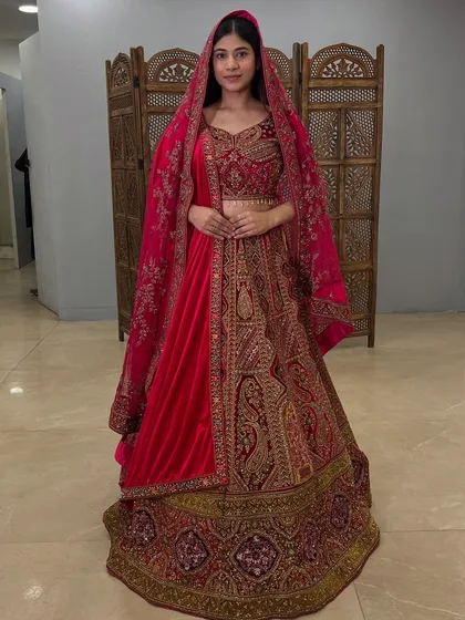 The rich texture and deep color of this velvet lehenga ensure you look absolutely regal on your wedding day.
