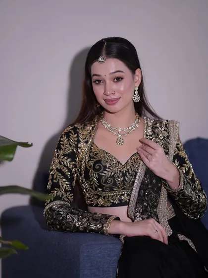 A full portrait showing the complete Sangeet or reception look, exuding elegance and charm.