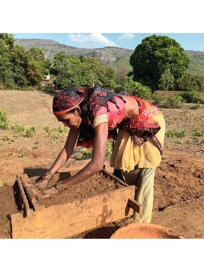 A local woman in Madhya Pradesh crafting mud blocks by hand for a community homestay. We prioritize using hyper-local materials and traditional building skills, which empowers the community and creates architecture that is truly of its place.