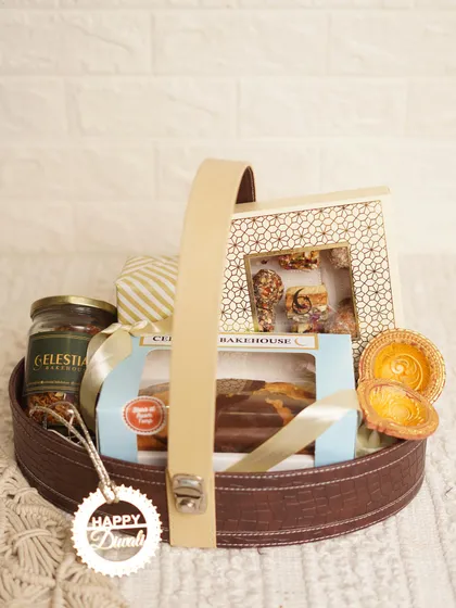 The 'Royal Basket' for Diwali, shown with its elegant handle, is a luxurious gift filled with our finest bakes and festive decorations.