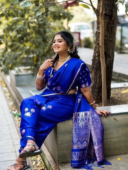Another powerful pose in the blue Nauvari, capturing the essence of a modern, confident bride.