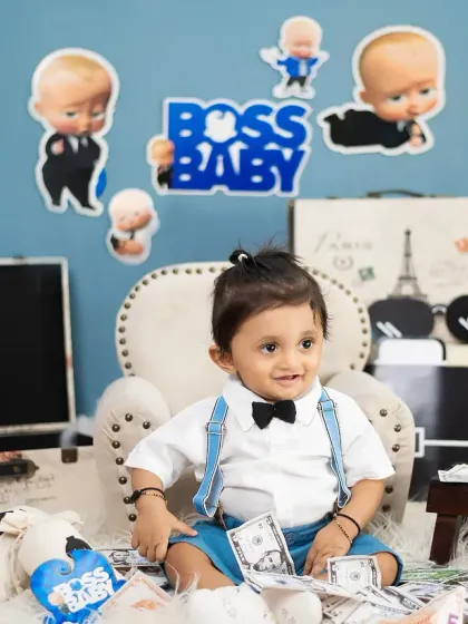 This little guy is ready to take on the world in our Boss Baby setup, complete with a tiny suitcase and a confident smile.