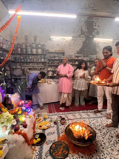 The community stands together for the final aarti, a moment of collective prayer and reverence.