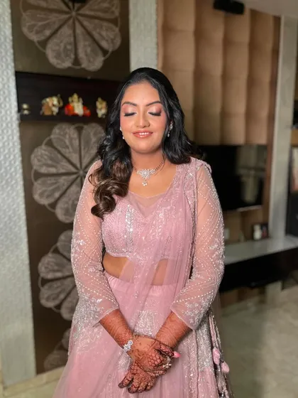 The closed-eye shot showcases the soft, shimmery pink eyeshadow that was the centerpiece of this engagement makeup.