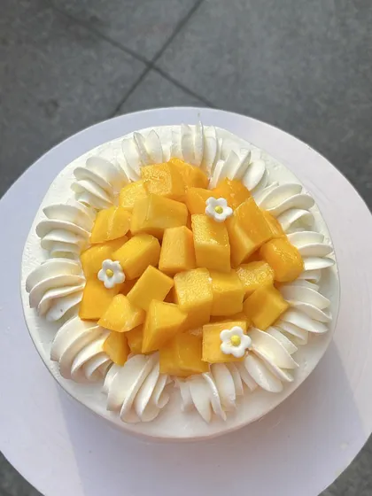 This light and airy Mango Dream Cake is made with a pillowy sponge soaked in fresh mango puree for maximum flavor.