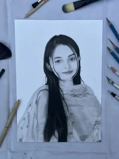 The finished Noida portrait, displayed on my workspace with the tools I used to create it.