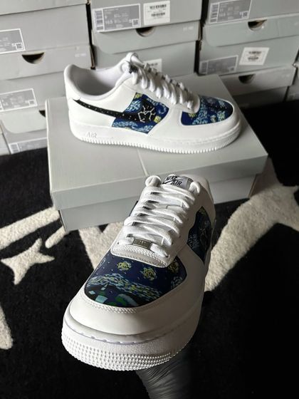 A custom Nike Air Force 1 with a galaxy and constellation pattern on the side panels.