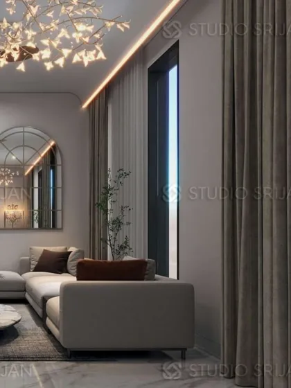 This angle showcases the interplay of light, with a modern "tree" chandelier, recessed ceiling lights, and a large arched mirror reflecting the room's brightness.