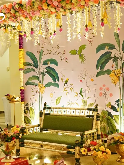 I have a deep appreciation for tradition, and I love planning beautiful Godhbarai or Seemant ceremonies. This setup features a traditional floral jhoola (swing) against a custom illustrated backdrop, blending timeless rituals with elegant, modern decor.