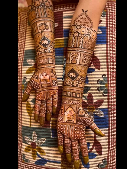 Intricate bridal hands with personalized elements like initials and elephants. Every detail is carefully crafted to create a masterpiece.