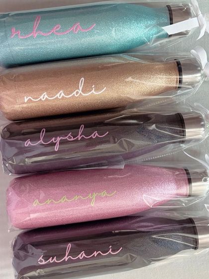 A lineup of our sparkle chic bottles, all packed and ready to be gifted. They make fantastic presents for bridesmaids, birthdays, or any special occasion.