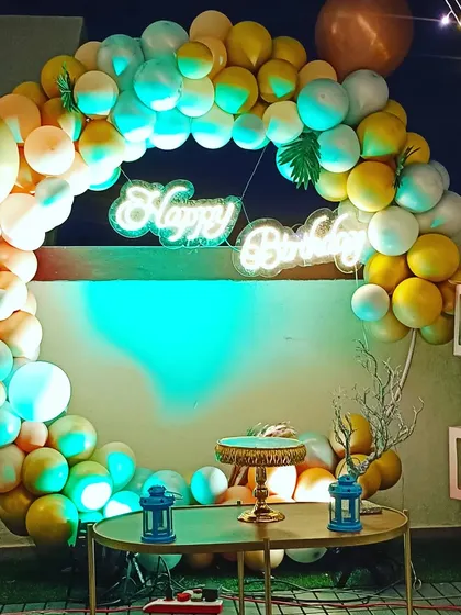 Another view of the elegant terrace setup, showcasing the balloon-filled transparent boxes and fairy lights that add a touch of whimsy and romance.