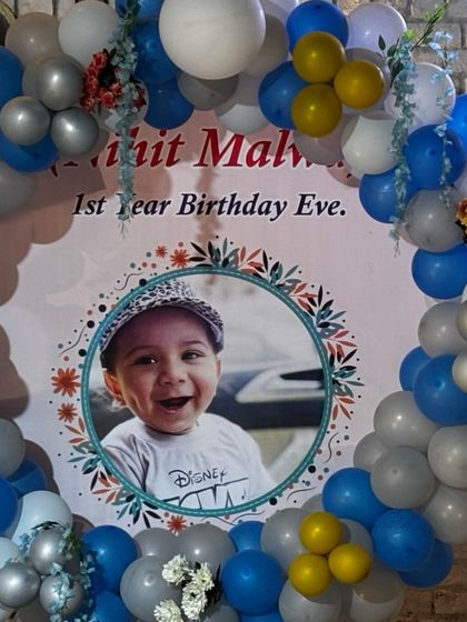 Another shot of the beautiful balloon decor for the first birthday celebration. I can arrange decorations in any theme or color scheme you like.