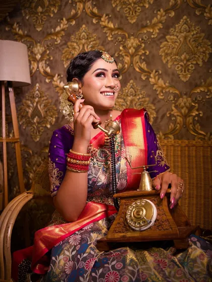 A fun, retro-style shot with a vintage telephone, showing how makeup can be used for creative concepts.