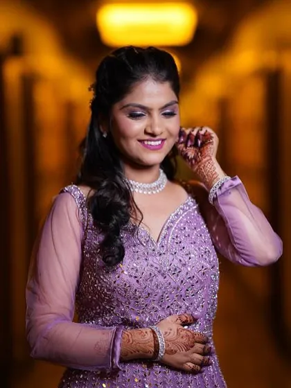 An absolute vision for her engagement. This look was all about glam, with sparkling purple eyeshadow to match her gown and a radiant finish that made her glow all evening.