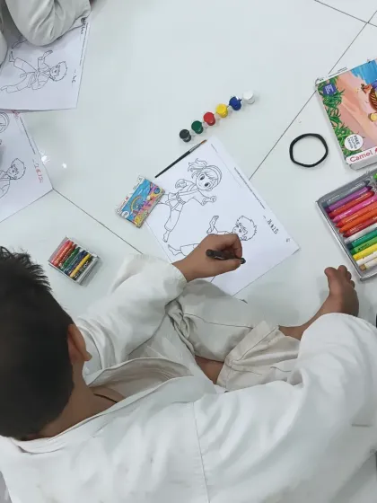 A little joy time for my karatekas. An overhead view of the students focused on their coloring sheets after class.