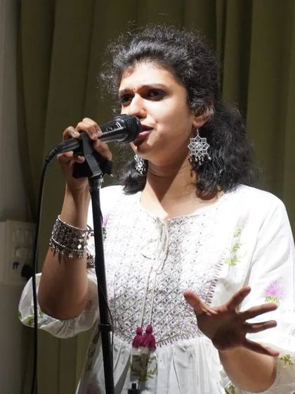 A storyteller sharing a personal tale during a solo show.