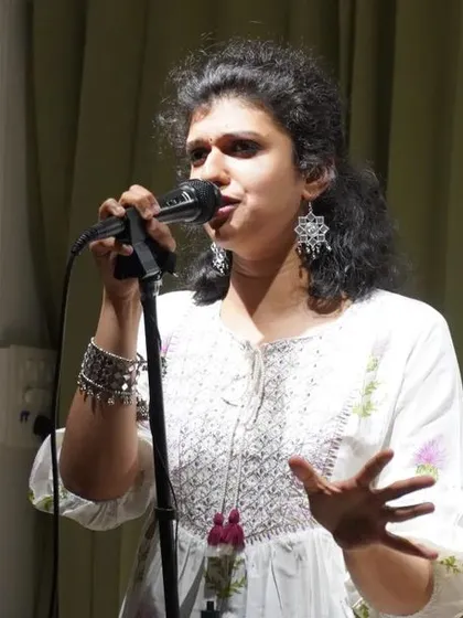 A storyteller sharing a personal tale during a solo show.
