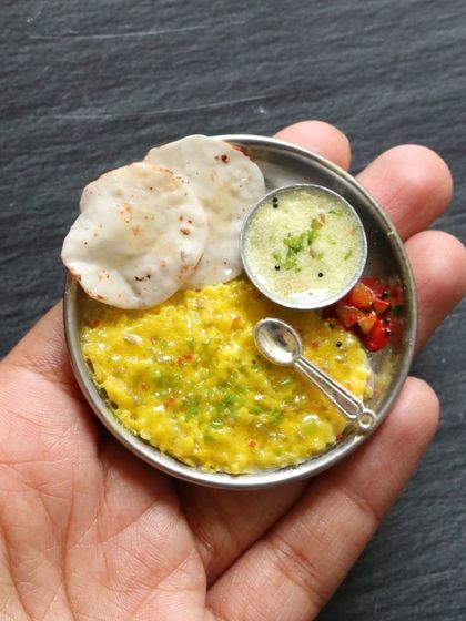 A tiny plate of khichdi and kadhi, a classic comfort food combination.