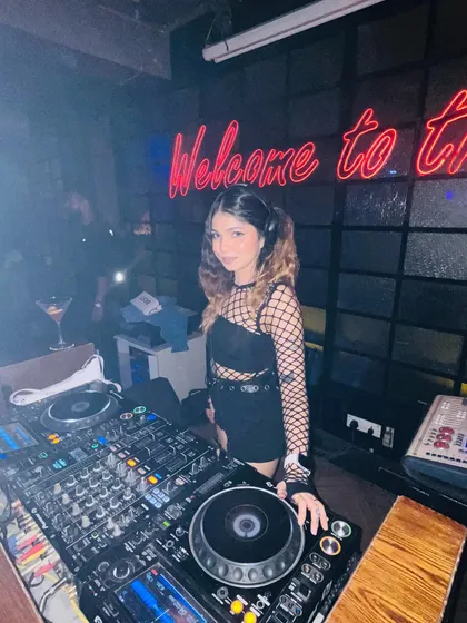 Ready to kick off the night at a club in Varanasi. The "Welcome to the..." sign set the perfect mood.