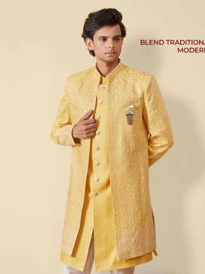 East meets West. A model in a yellow layered Indo-Western outfit, showcasing how we blend traditional silhouettes with modern style for a fresh, elegant look.