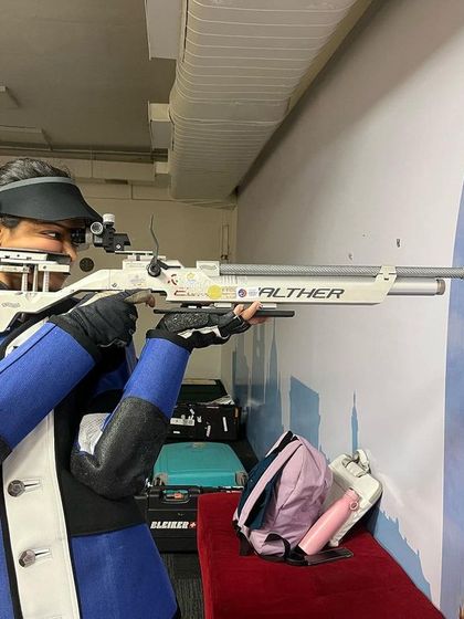 Athlete Meghana Sajjanar demonstrates perfect form during a 10M Air Rifle training session. Her score of 631.5 in the Indian team trials is a result of such dedicated practice.