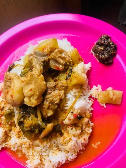 My fresh pork and bottle gourd curry served over a plate of hot rice with a side of spicy pickle.