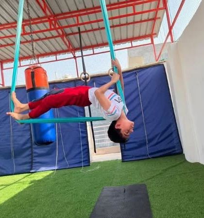 This is how we learn to trust the hammock. This child is practicing a gentle backbend, supported completely by the fabric.