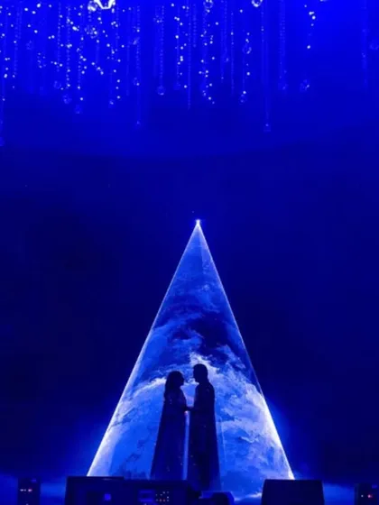 For a Sangeet night that was truly written in the stars, I created this dramatic silhouette moment. Using a cosmic projection against a deep blue backdrop, this design element transformed a performance into a celestial event, capturing the couple's love story in a single, powerful image.