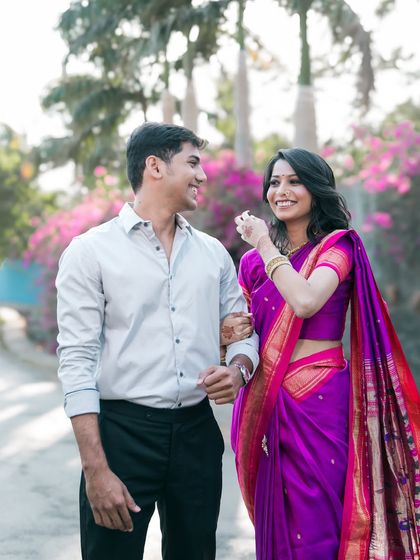A playful glance and a happy smile while walking together. Our pre-wedding photography is all about capturing your natural interactions.