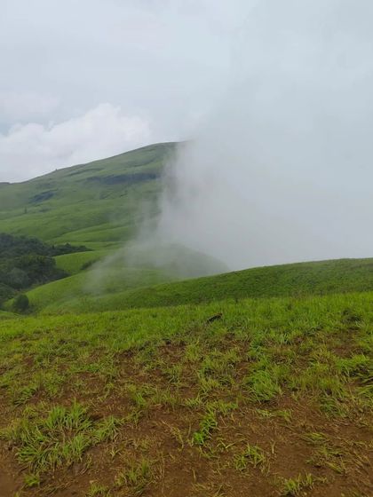 The clouds playing hide and seek with the green hills of Netravati. Every few minutes, the view changes completely.