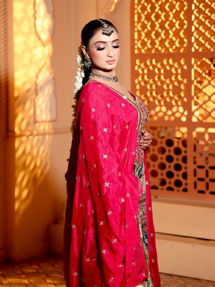 This look has my heart. A beautiful side profile of my bride, showing her elegant hairstyle and the rich colors of her outfit.