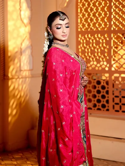 This look has my heart. A beautiful side profile of my bride, showing her elegant hairstyle and the rich colors of her outfit.