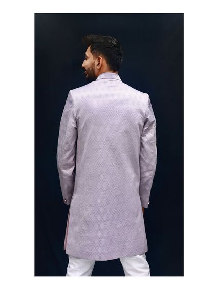 A perfect fit from every angle. The back view of our lavender Indo-Western shows the clean lines and expert tailoring that ensure you look sharp all day long.