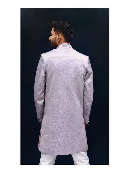 A view from the back of the lavender Indo-western. This angle shows the clean lines and perfect fit of the garment, highlighting the quality of the tailoring and the continuous pattern of the fabric.