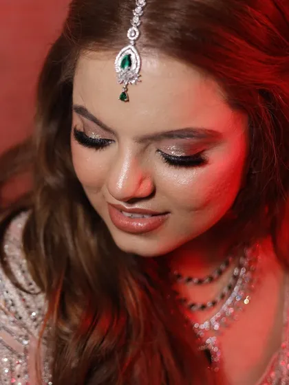 This shot highlights the shimmery, glamorous eye makeup perfect for an evening event.