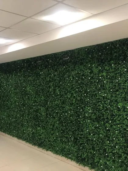 Even a simple office corridor can be made more engaging. We covered the walls of this hallway with our boxwood panels, turning a plain walkway into a more pleasant and vibrant space.