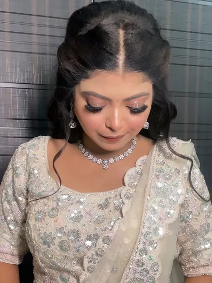 A close-up of a beautiful HD engagement makeup look. The glittery eyes and flawless base are the stars of the show.