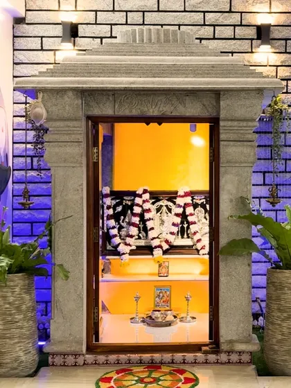 A dedicated space for peace and prayer. This unique pooja unit, crafted from traditional stone, stands as a spiritual centerpiece, blending seamlessly with the home's modern aesthetic while honoring timeless traditions.
