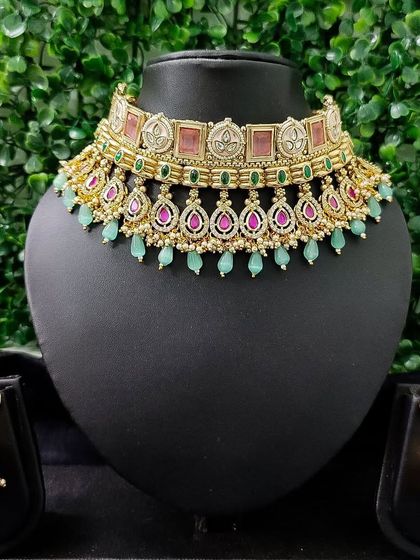 The full view of this pastel set, including the choker and matching jhumka earrings.